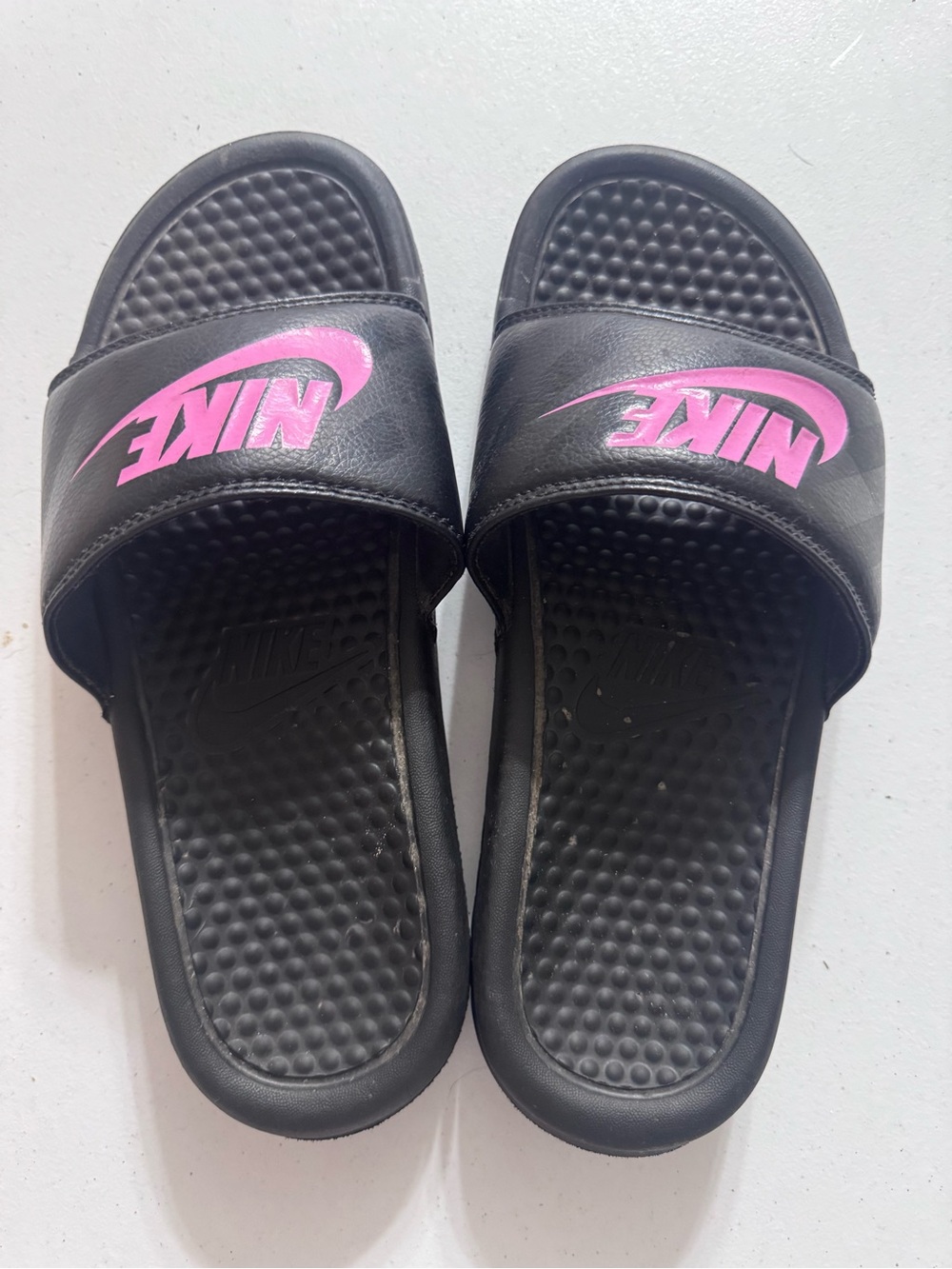 Nike Black Slides with Pink Swoosh Logo